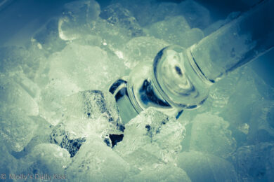 Glass dildo in ice bucket