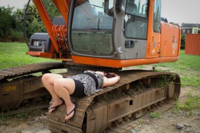 Naked woman on digger