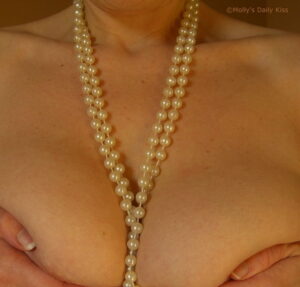 woman wearing pearl necklace