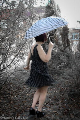 Swirling dress with colour splash and spotty umbrella