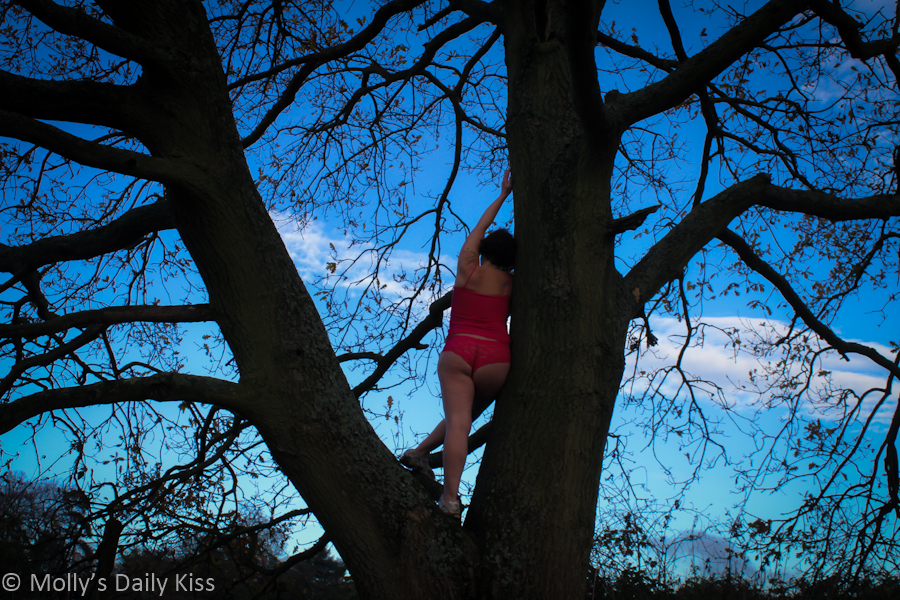 Standing in tree in pink underwear