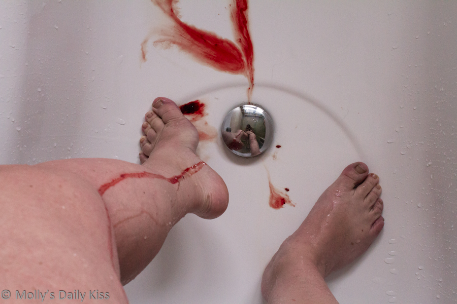 Menstrual blood running down legs in the shower