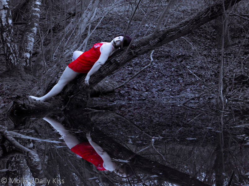 Red lingerie reflected in pond