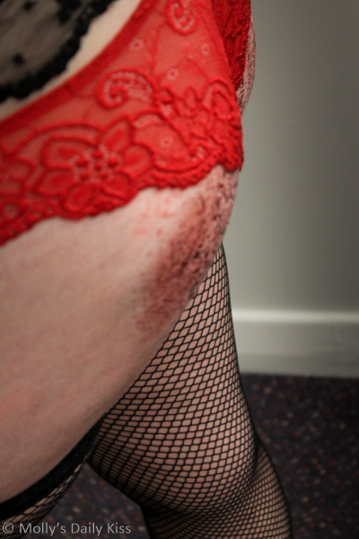 Bloody red bottom and fishnet stockings