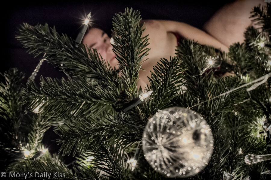 Molly underneath the Christmas tree