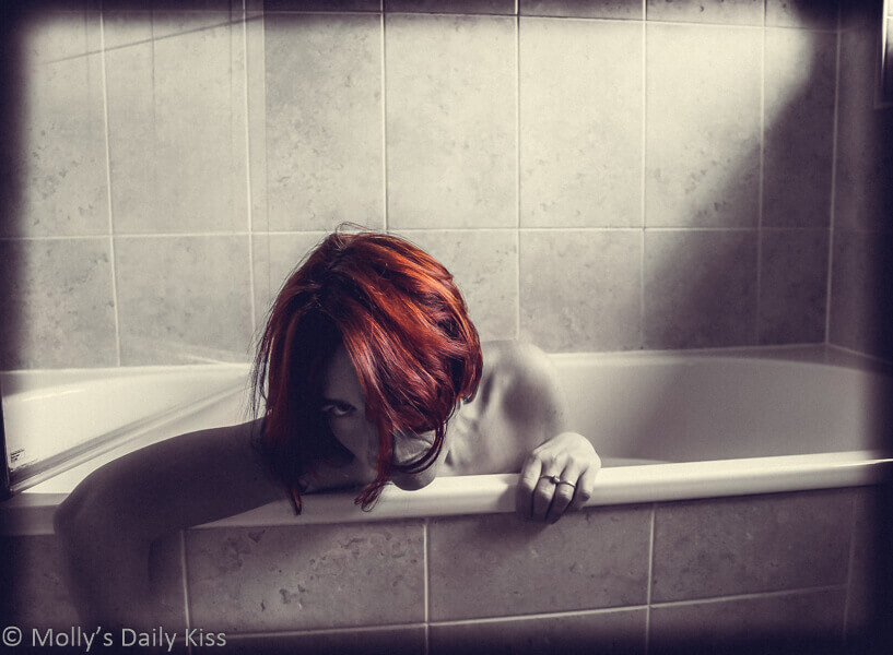 Molly in the bath with copper hair