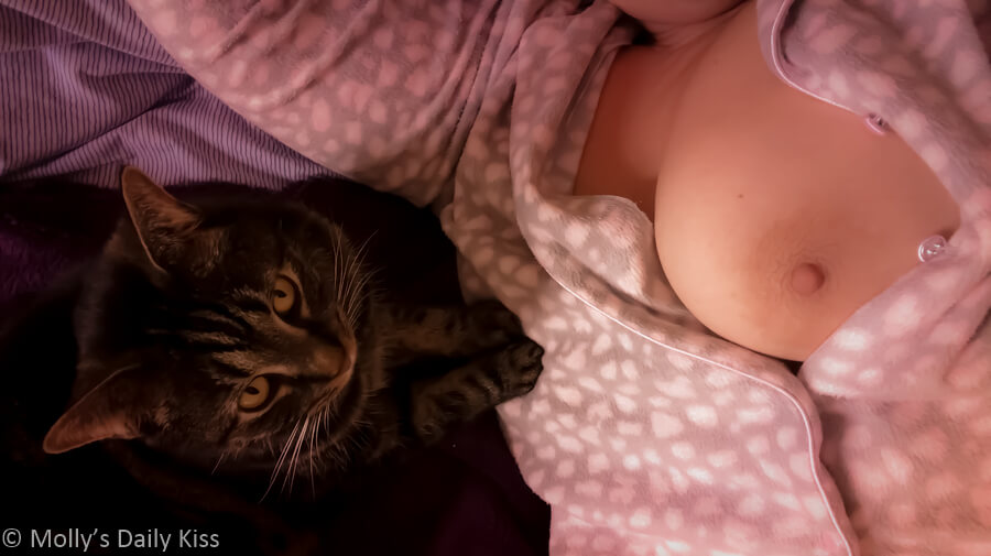 Molly flashing boob in her PJ's with cat snuggles